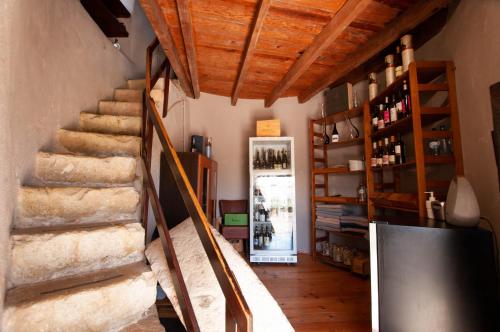 a stairway in a room with a room with a refrigerator at Windmill by OCvillas in Albufeira