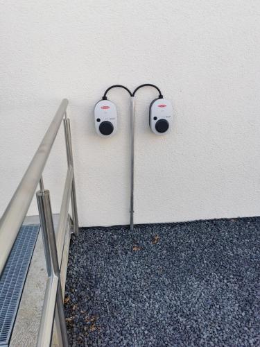 a room with two speakers on a wall at Hotel Garni Jägerhof in Sigmaringen