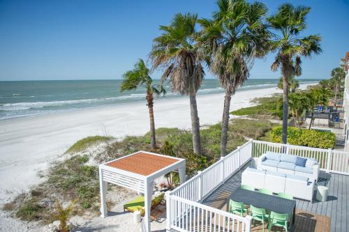 a balcony with a view of the beach at Sunburst Inn- Indian Shores Beach in Clearwater Beach