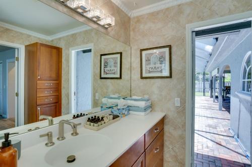 a bathroom with a sink and a mirror at Spacious Wellington Vacation Rental - Private Pool in Wellington