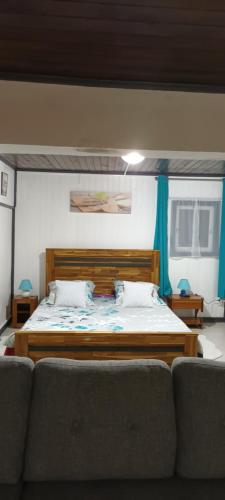 Кровать или кровати в номере Appartement les Saules à Cilaos