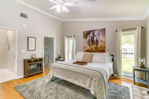 ein Schlafzimmer mit einem Bett und einem Kamin in der Unterkunft Wellington Vacation Rental Private Saltwater Pool in Wellington