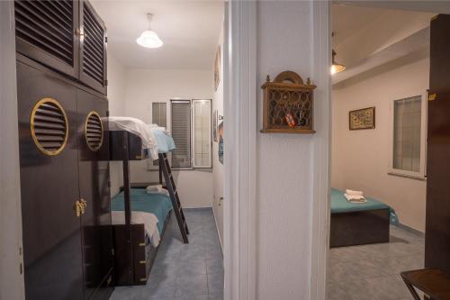 a hallway with a room with a bunk bed at Casa Gloria in Positano