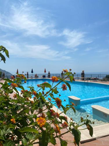 a view of a swimming pool with the ocean in the background at Casa Gloria in Positano