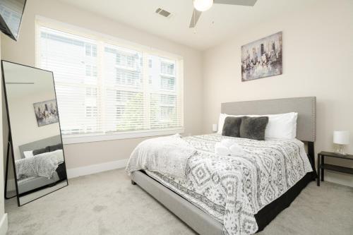 a bedroom with a bed and a window at Atlanta’s Summerhill Stay in Atlanta