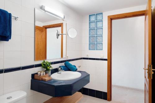 a bathroom with a sink and a mirror at Callao Beach 5 in Arrieta