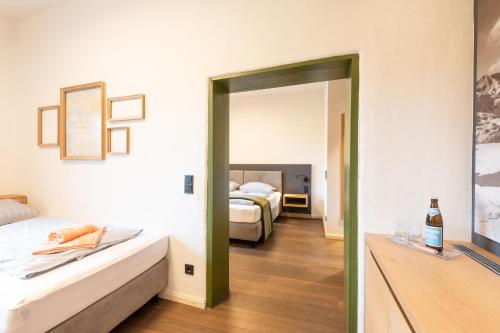Letto o letti in una camera di LANDHOTEL ALTE ZOLLSTATION- Historical Building