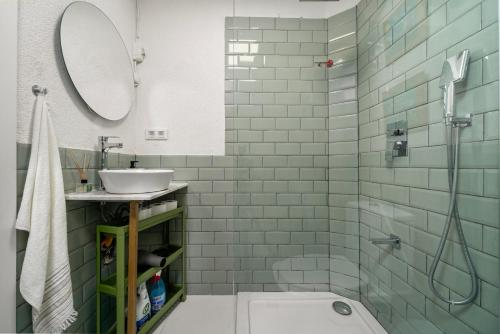 a bathroom with a sink and a toilet and a mirror at Kusadasi, Villa Simsek in Kusadası