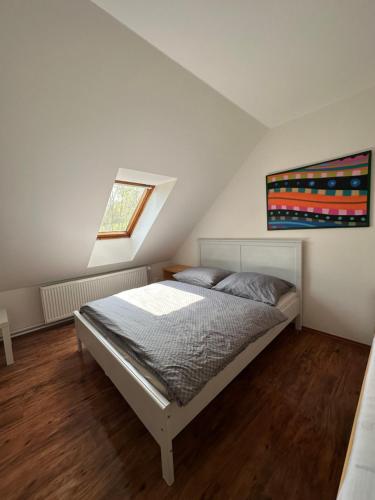a bedroom with a bed in a attic at Degustarium Bavory in Bavory
