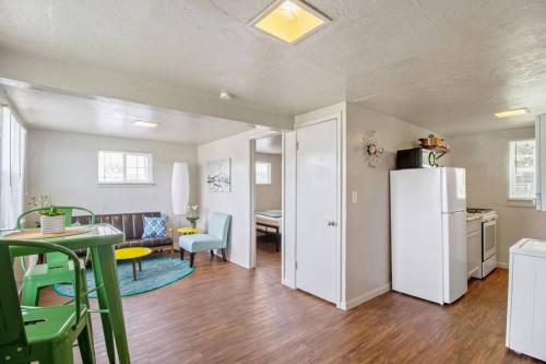 a kitchen and living room with a refrigerator and a table at Affordable for long stay great for travel workers in Oklahoma City