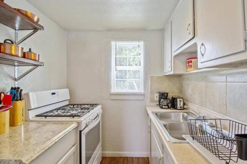 a kitchen with a stove top oven next to a sink at Affordable for long stay great for travel workers in Oklahoma City