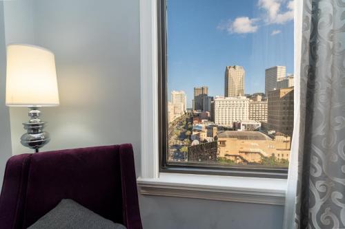 a window with a view of a city skyline at Hampton Inn & Suites New Orleans Canal St. French Quarter in New Orleans