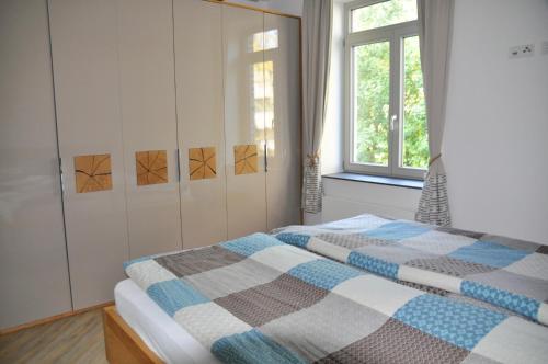 Postel nebo postele na pokoji v ubytování Burg und Burgstaaken Ferienwohnung Nordlicht