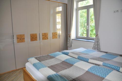 Postel nebo postele na pokoji v ubytování Burg und Burgstaaken Ferienwohnung Nordlicht