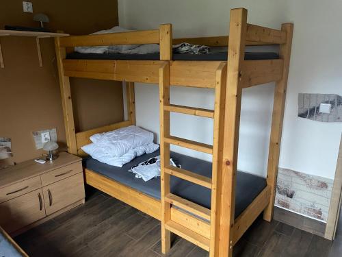 Postel nebo postele na pokoji v ubytování Apartmány u Dlouhána