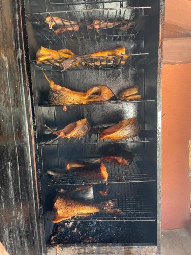 a rack of food cooking in an oven at Apartmány u Dlouhána in Kadaň