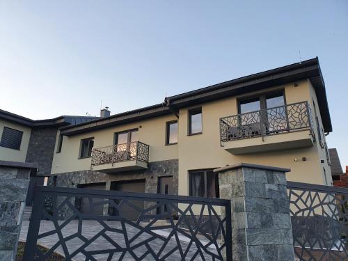 a building with balconies on the side of it at Apartmány Zaky in Vrbov