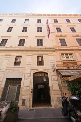 a large building with a door in front of it at Hotel Terrazza Magenta in Rome