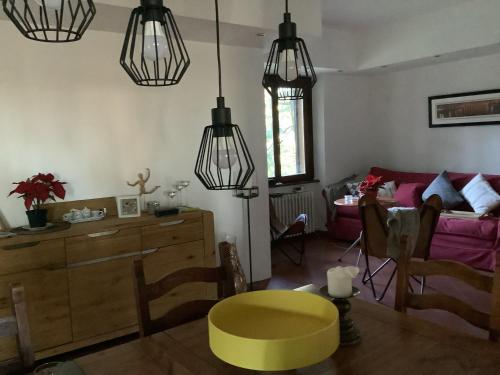 a living room with a yellow table and a couch at Villamonestevole501 in Umbertide