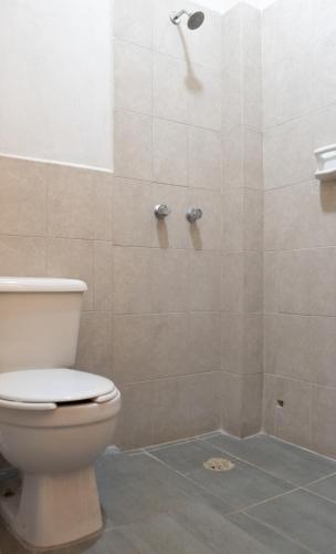 a bathroom with a shower with a toilet at Hotel Esperanza, Oaxaca Centro in Oaxaca City