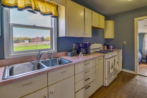 a kitchen with a sink and a window at Upstate New York Vacation Rental Near Cooperstown! in Cherry Valley