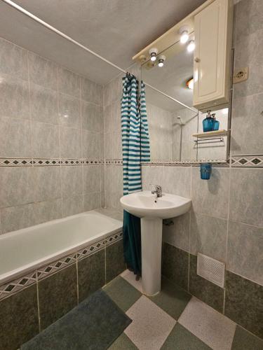 a bathroom with a sink and a bath tub at Labriega del hueznar in Cazalla de la Sierra