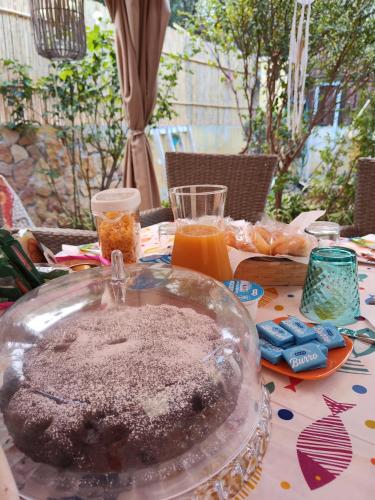 a table with a glass bowl of food on it at La Pirata Capitana in Costa degli Angeli