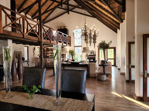 a large living room with a dining room and a kitchen at Karongwe Portfolio - Kuname Lodge in Karongwe Game Reserve