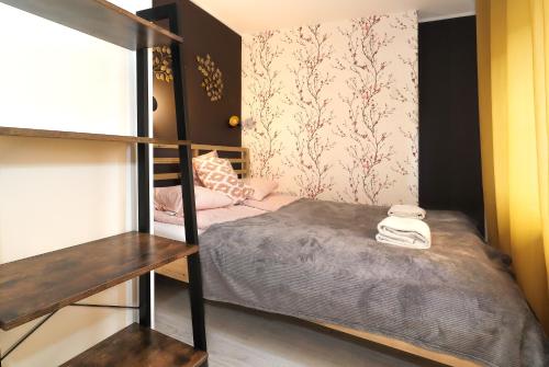 Кровать или кровати в номере Gdynia Cozzi Apartment