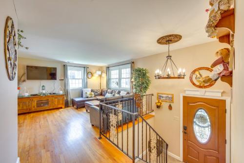 a living room with a couch and a table at 10 Mi to Dtwn Lancaster Charming Home with Yard! in Leola