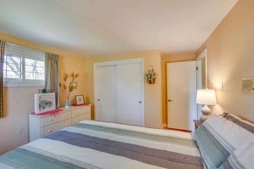 a bedroom with a large bed and a window at 10 Mi to Dtwn Lancaster Charming Home with Yard! in Leola