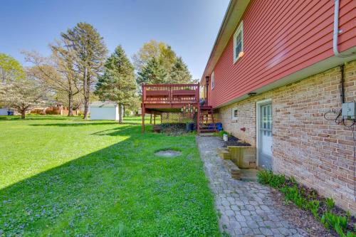a brick building with a deck on the side of it at 10 Mi to Dtwn Lancaster Charming Home with Yard! in Leola