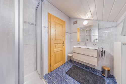 a bathroom with a tub and a sink and a shower at Apart Bergzeit in Umhausen