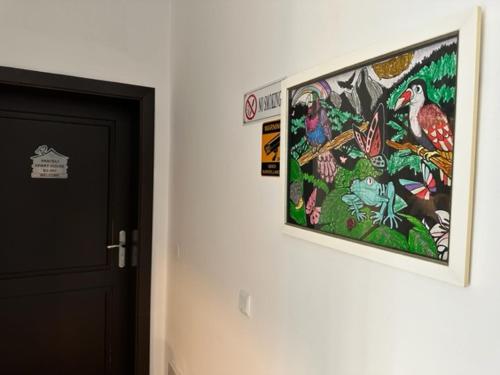 a picture hanging on a wall next to a door at PANTELI APART HOUSE in Aheloy
