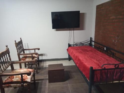 En eller flere senge i et værelse på Emilia I