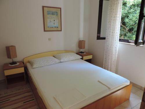 Katil atau katil-katil dalam bilik di Apartmani Lavanda
