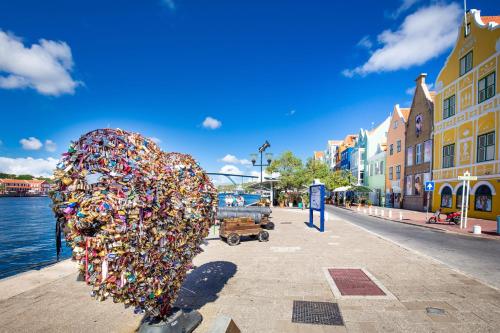 a sculpture of a head made out of locks at Downtown Dreamstay, Classic 2BR Suites in Willemstad