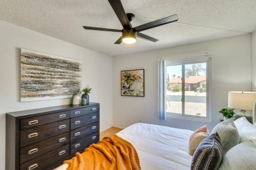 a bedroom with a bed and a ceiling fan at 5 Mi to Ocotillo Golf Course Chic Sun Lakes Home! in Sun Lakes