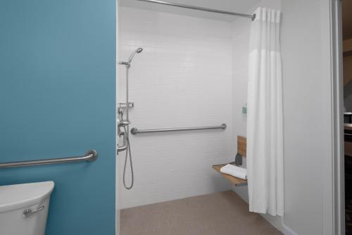 a bathroom with a shower and a toilet at Residence Inn White Plains Westchester County in White Plains