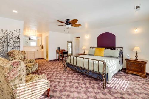 a bedroom with a bed and a couch and a chair at Spacious Hildale House with Large Deck! in Hildale