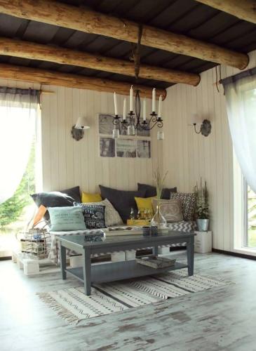 a living room with a couch and a table at My little happy place in Undva
