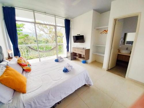 Postel nebo postele na pokoji v ubytování CasaMIA Hotel Boutique - Villeta