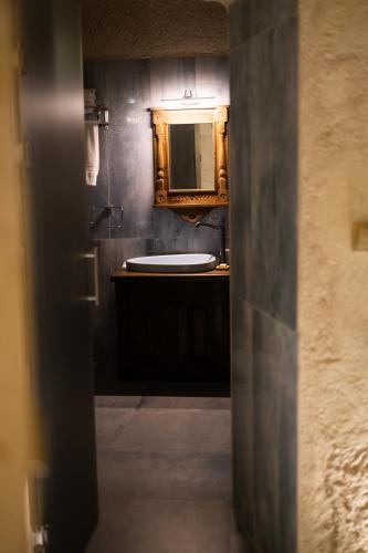 a bathroom with a sink and a mirror at Vigor Cappadocia - Special Class in Uchisar