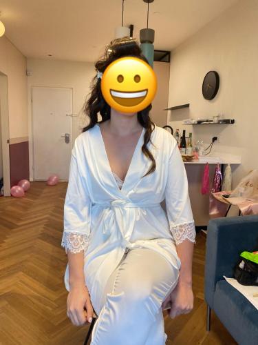 a woman with a yellow smiley face on her head at lasuita- exclusive suites cesarea- sea view suite in Caesarea