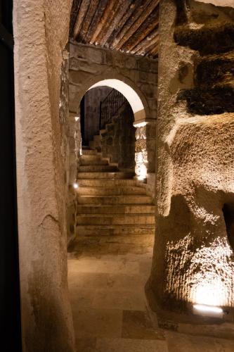 a hallway with stairs in an old building at Vigor Cappadocia - Special Class in Uchisar