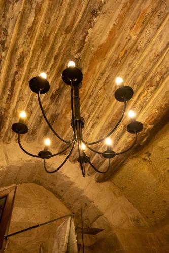 a chandelier hanging from the ceiling of a room at Vigor Cappadocia - Special Class in Uchisar