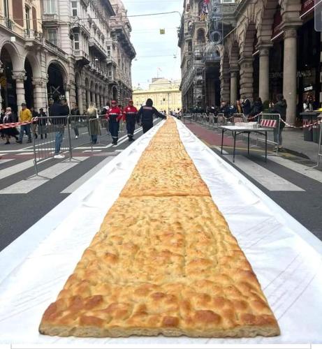 a large large piece of food on a street at B&B Amarantha Gothica Genoa in Genova