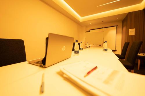 a laptop computer sitting on a table in a conference room at Slavija Culture Heritage Hotel in Split