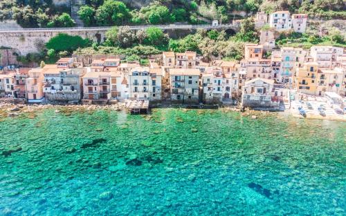 an aerial view of a town on the water at U Catoiu in Scilla