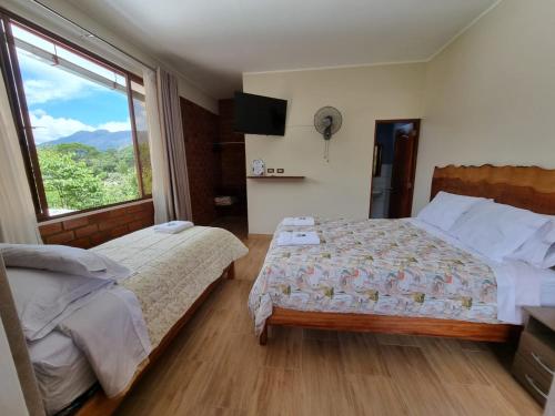 Postel nebo postele na pokoji v ubytování Pampa Bella Lodge